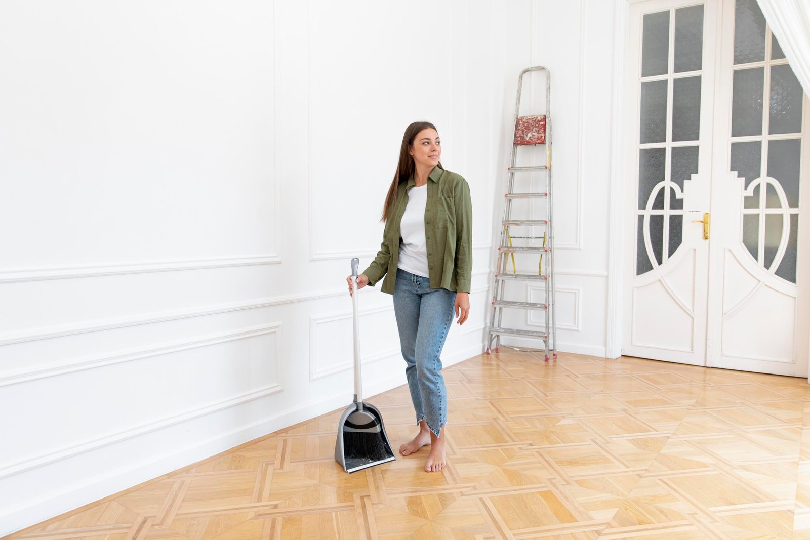 full-shot-woman-holding-broom
